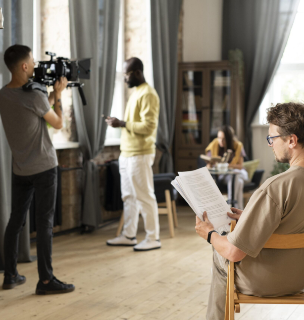 man-filming-with-professional-camera